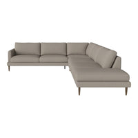 Light beige sectional sofa with modern design and clean lines, featuring soft fabric upholstery and wooden legs.