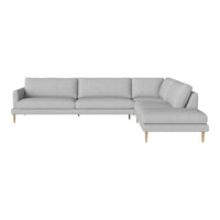 Light gray sectional sofa with a minimalist design and smooth fabric texture. Natural wooden legs.