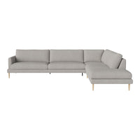Light grey sectional sofa with clean lines and soft fabric, featuring natural wood legs for a modern look.