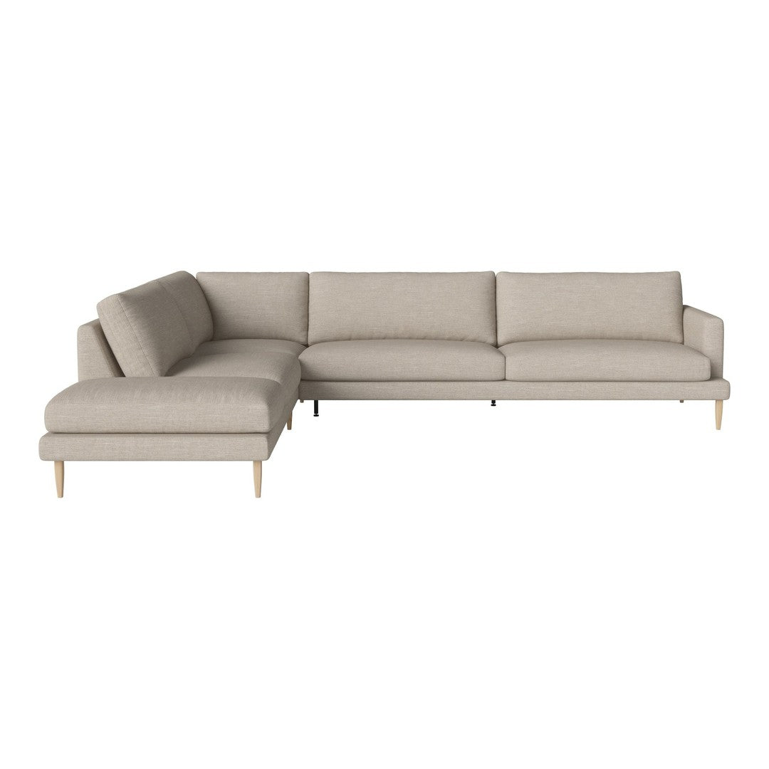 Beige sectional sofa with smooth fabric texture and simple, modern design. Subtle, neutral tones for versatile decor.