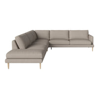 Light beige sectional sofa with simple lines and a textured fabric, featuring natural wood legs. Perfect for modern decor.
