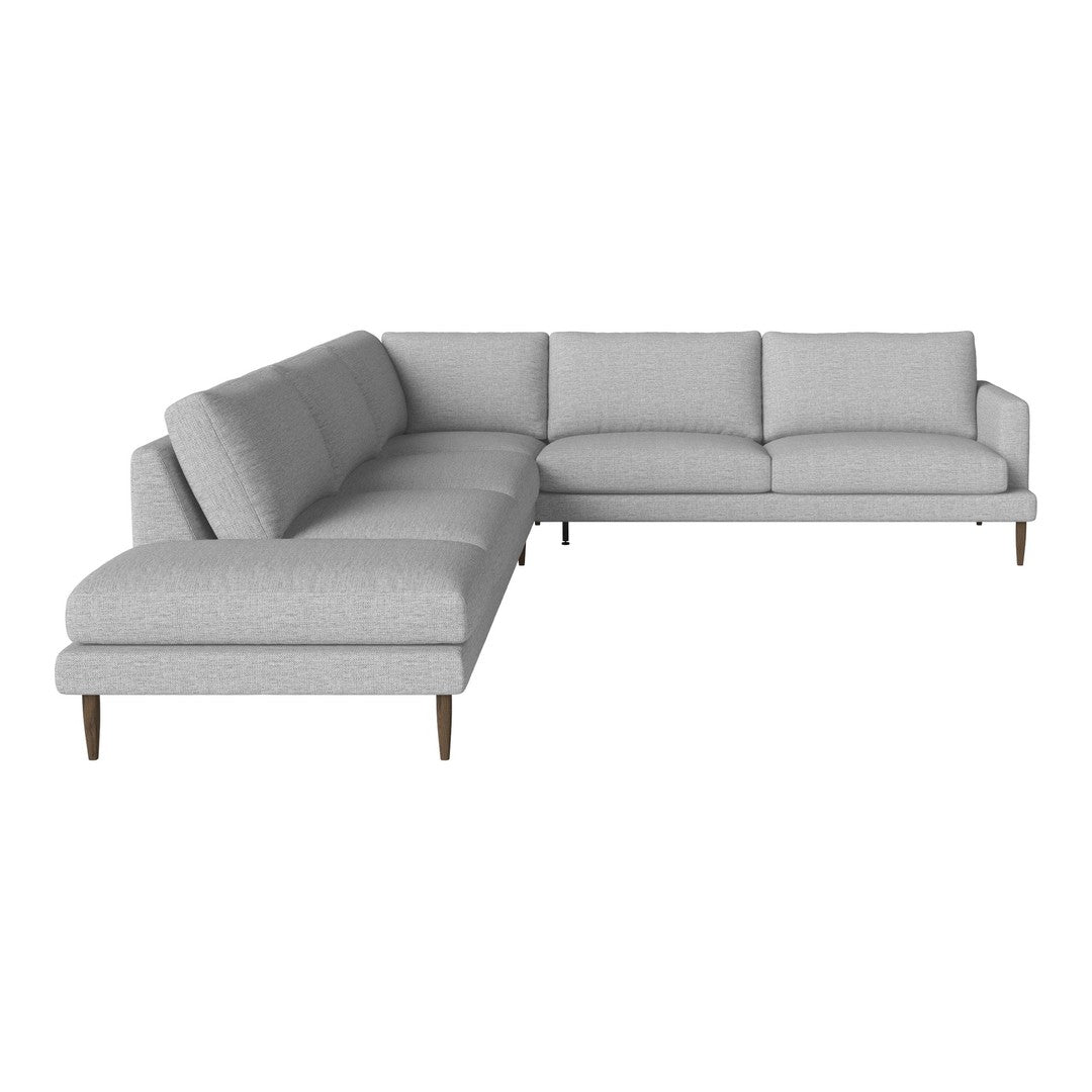 Light gray sectional sofa with a smooth fabric finish and clean lines, featuring minimalistic wood legs.
