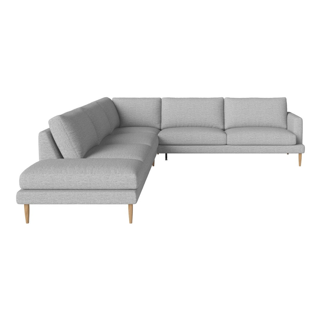 Light gray sectional sofa with a minimalist design and wooden legs, featuring a smooth, textured pattern.