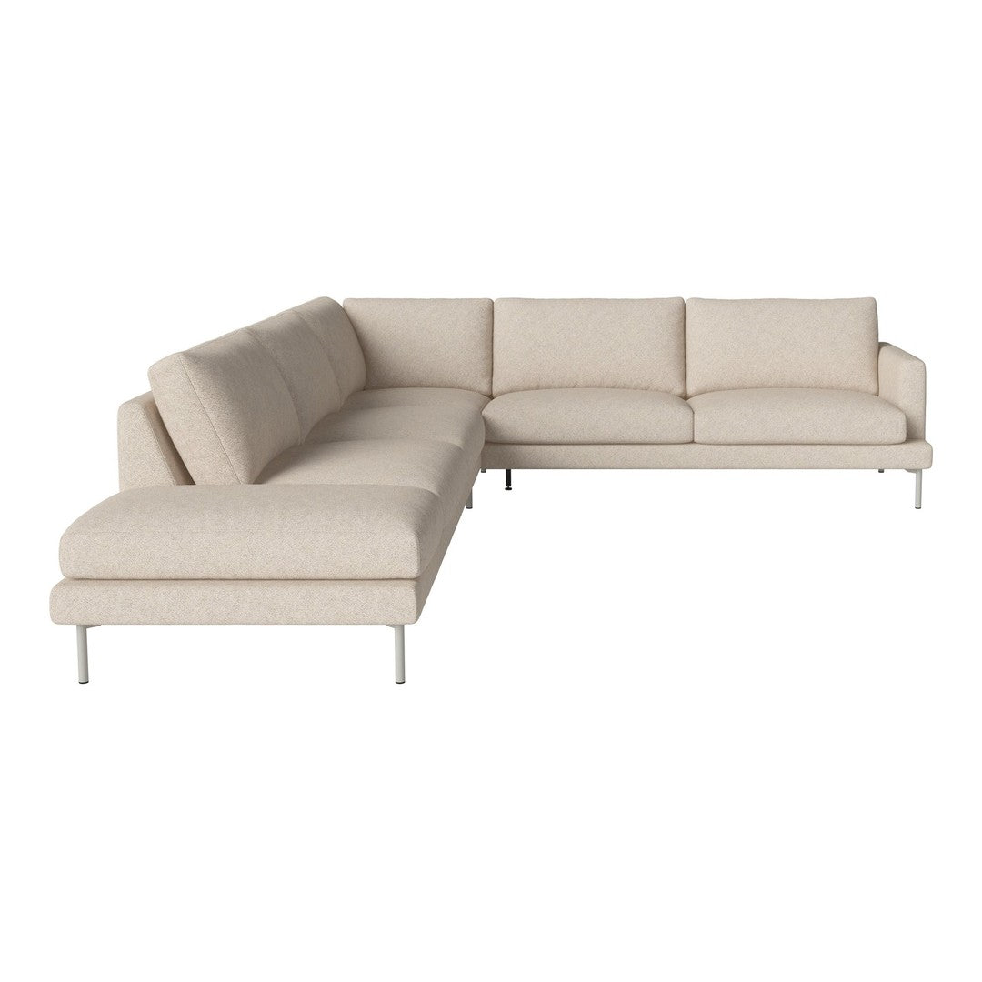 Light beige sectional sofa with a smooth, textured fabric and modern metallic legs. Stylish and minimalist design.