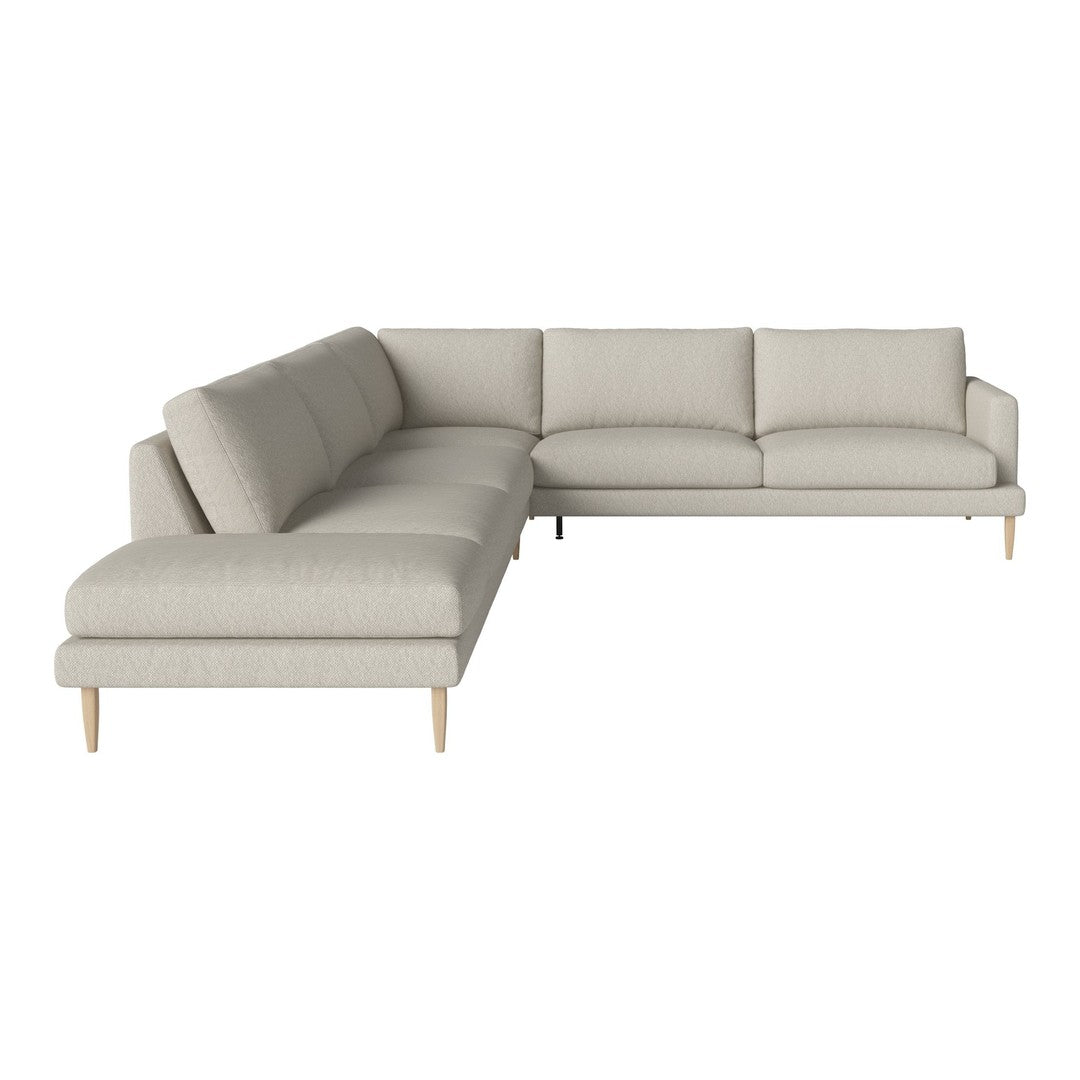 Light gray sectional sofa with clean lines and subtle texture, featuring natural wood legs for a modern touch.