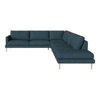 Teal sectional sofa with smooth upholstery and light wood legs, featuring a modern minimalistic design.