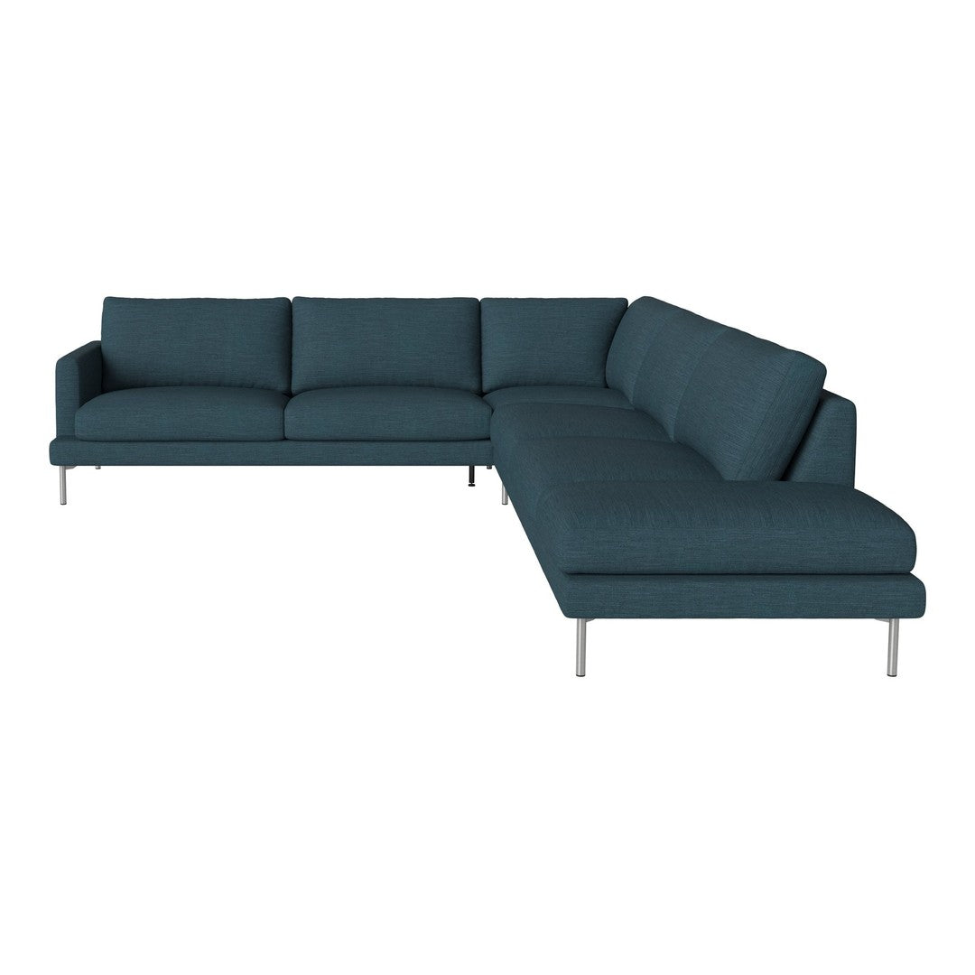Teal sectional sofa with clean lines and solid pattern, featuring plush cushions and sleek metal legs.