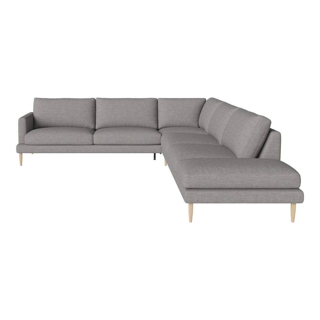 Gray sectional sofa with a modern design, featuring clean lines and soft upholstery. Ideal for contemporary decor.