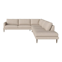 Beige sectional sofa with clean lines and a textured fabric pattern, ideal for modern living spaces.