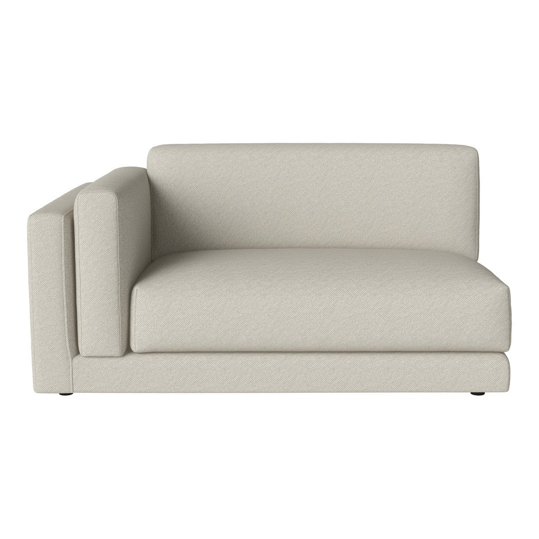 Light beige sectional sofa with a smooth texture and minimalist design, perfect for modern living spaces.