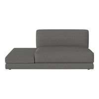 Modern gray chaise lounge with a sleek, minimalistic design and soft fabric upholstery. Perfect for contemporary spaces.