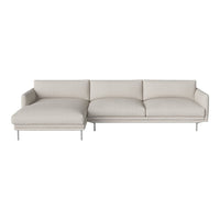 Light beige sectional sofa with smooth, clean lines and plush cushions on sleek metallic legs.