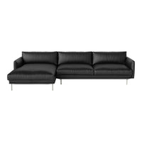 Black leather sectional sofa with sleek lines and a modern design, featuring a minimalist aesthetic.