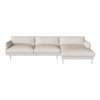 Light beige sectional sofa with clean lines and plush cushions on sleek metal legs, perfect for modern decor.