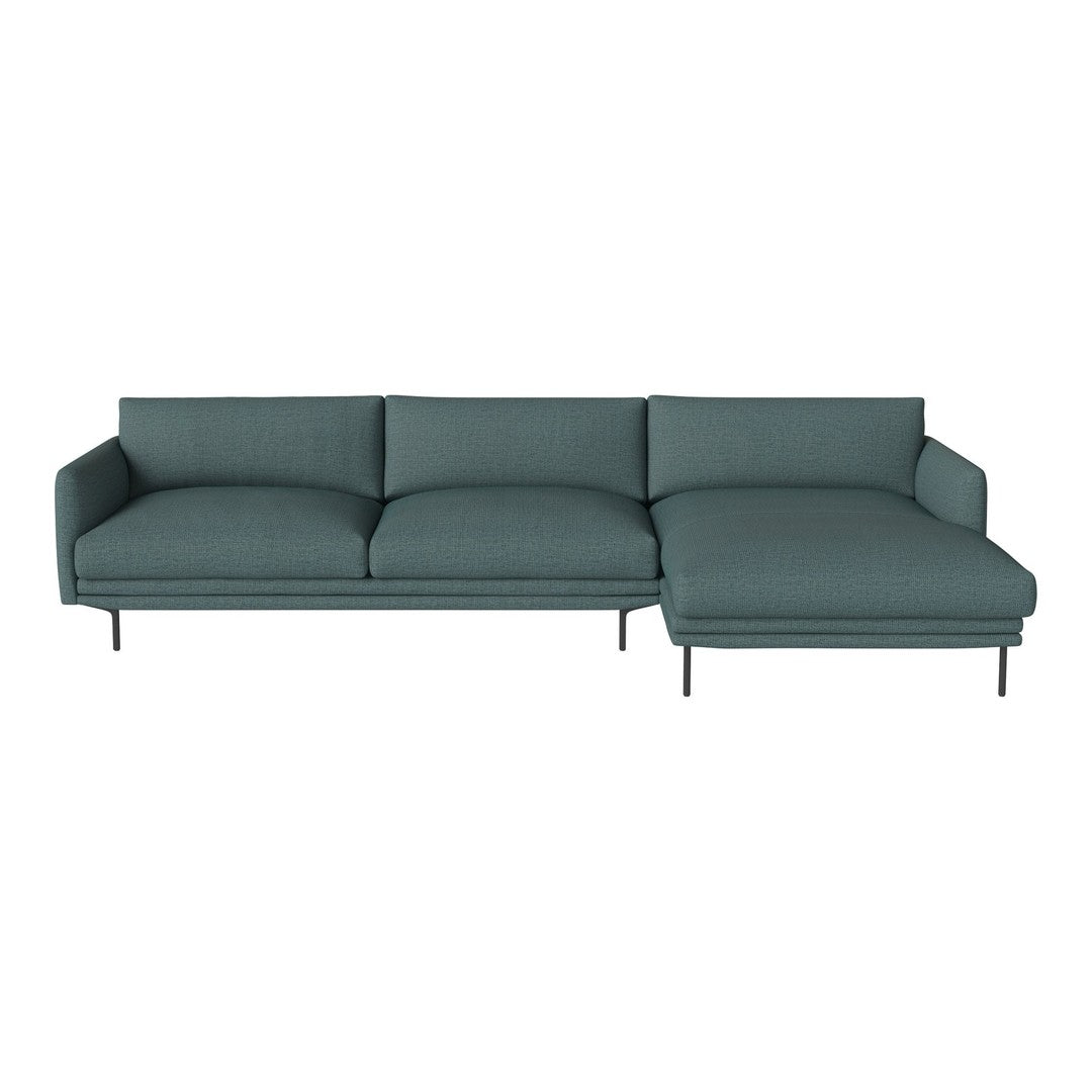 Teal modern sofa with sleek lines and subtle textured fabric, featuring a chaise lounge and minimalist metal legs.