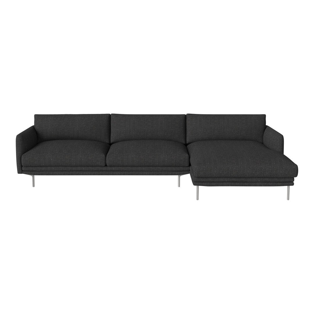 Modern dark gray sectional sofa with a sleek, minimalist design and soft-textured fabric. Stylish silver legs.