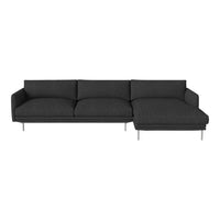 Modern dark gray sectional sofa with a sleek, minimalist design and soft-textured fabric. Stylish silver legs.