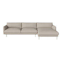 Light beige sectional sofa with a modern, minimalist design and plush cushions, showcasing a smooth fabric texture.