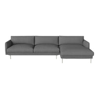 Gray sectional sofa with smooth upholstery and minimalistic design. Features solid color and modern legs.