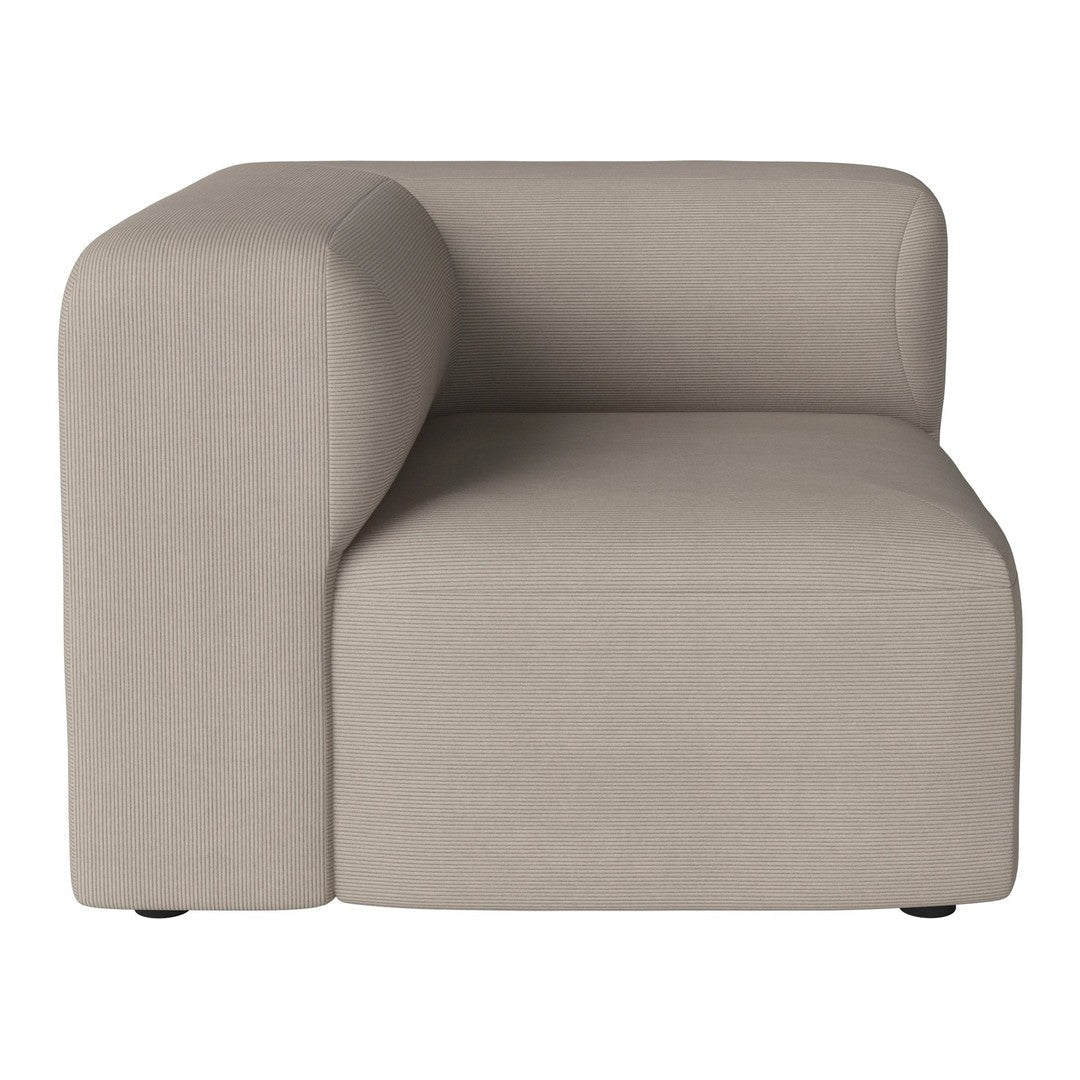 Beige modern corner chair with a smooth, minimalist design and soft upholstery, perfect for contemporary interiors.