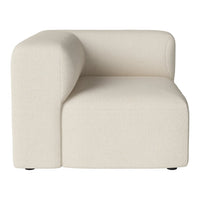 Cream-colored curved accent chair with a textured fabric, minimalist design, and seamless pattern.