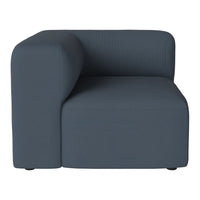 Dark blue ribbed fabric corner chair with a modern, minimalist design. Ideal for contemporary settings.