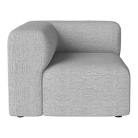 Gray fabric corner chair with a smooth texture and minimalist design, perfect for modern interiors.