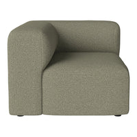 Modern green corner sofa with textured fabric and minimalist design. Ideal for contemporary living spaces.