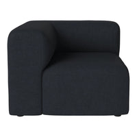 Black upholstered corner chair with a smooth, modern design and minimalist style. Perfect for contemporary interiors.