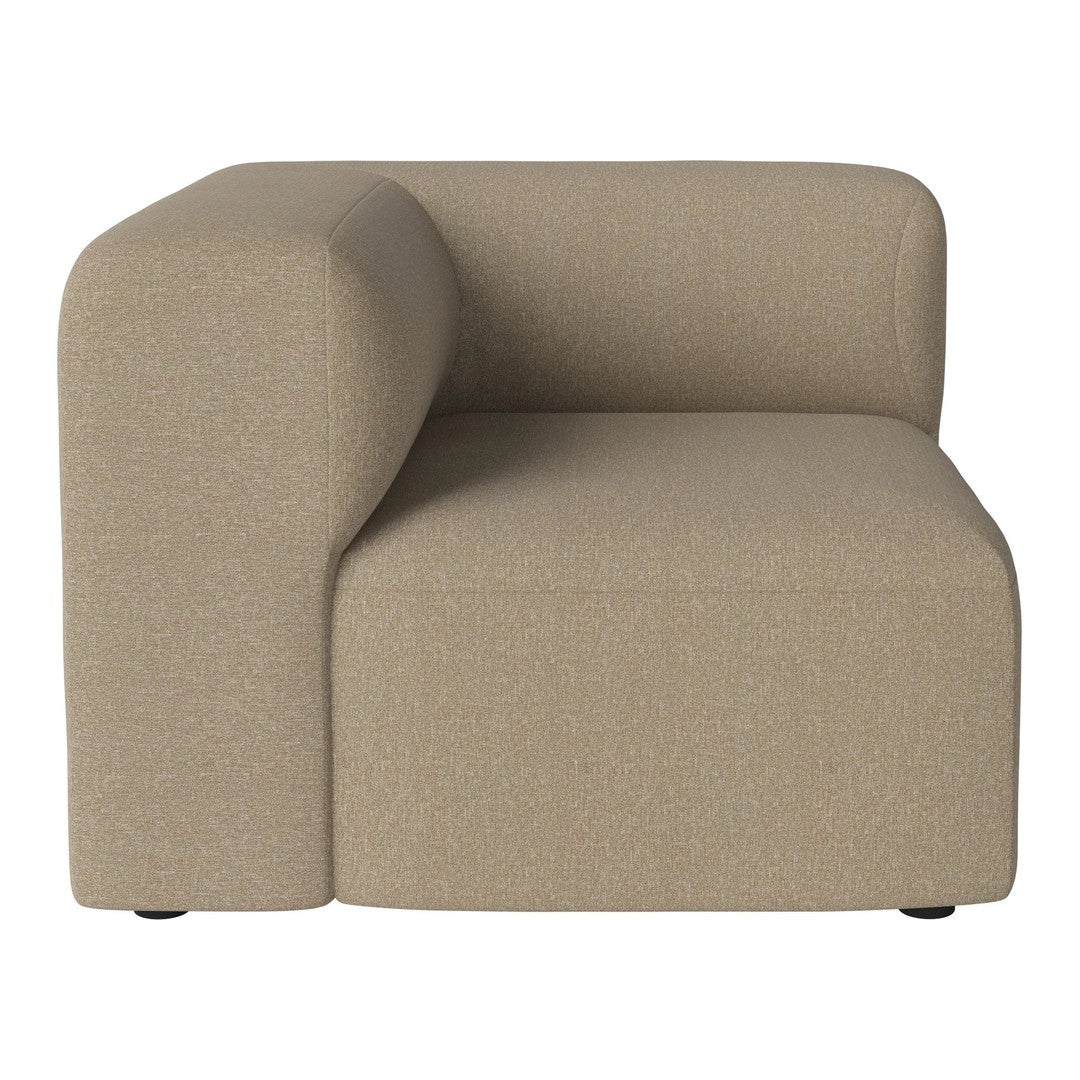 Beige upholstered corner chair with soft, rounded edges and a textured fabric finish, perfect for modern decor.