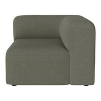 "Modern green sofa corner unit with a smooth, textured fabric and rounded armrest design."