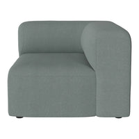 Textured light teal sectional sofa with a modern design and clean lines, perfect for contemporary living spaces.