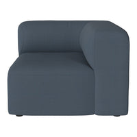 Dark blue textured armchair with a modern, minimalist design and subtle ribbed pattern. Ideal for contemporary decor.