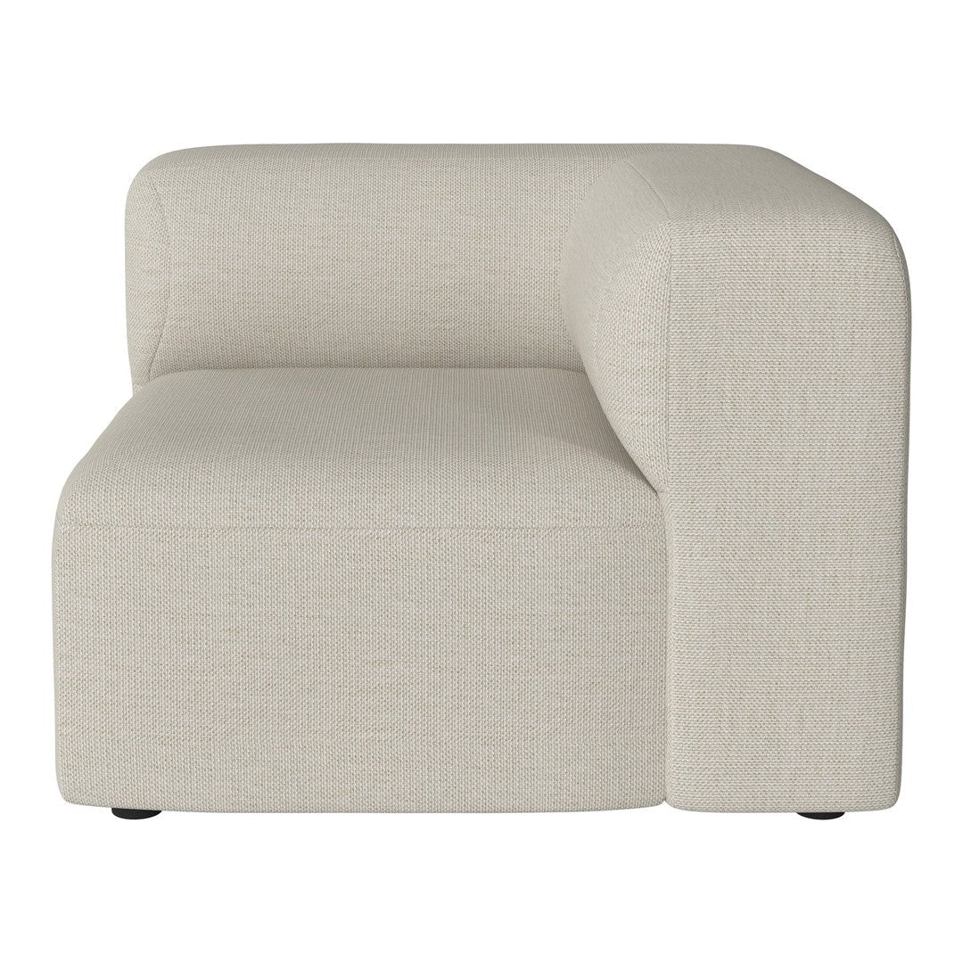Beige upholstered corner chair with a smooth, minimalist texture, perfect for modern living spaces.