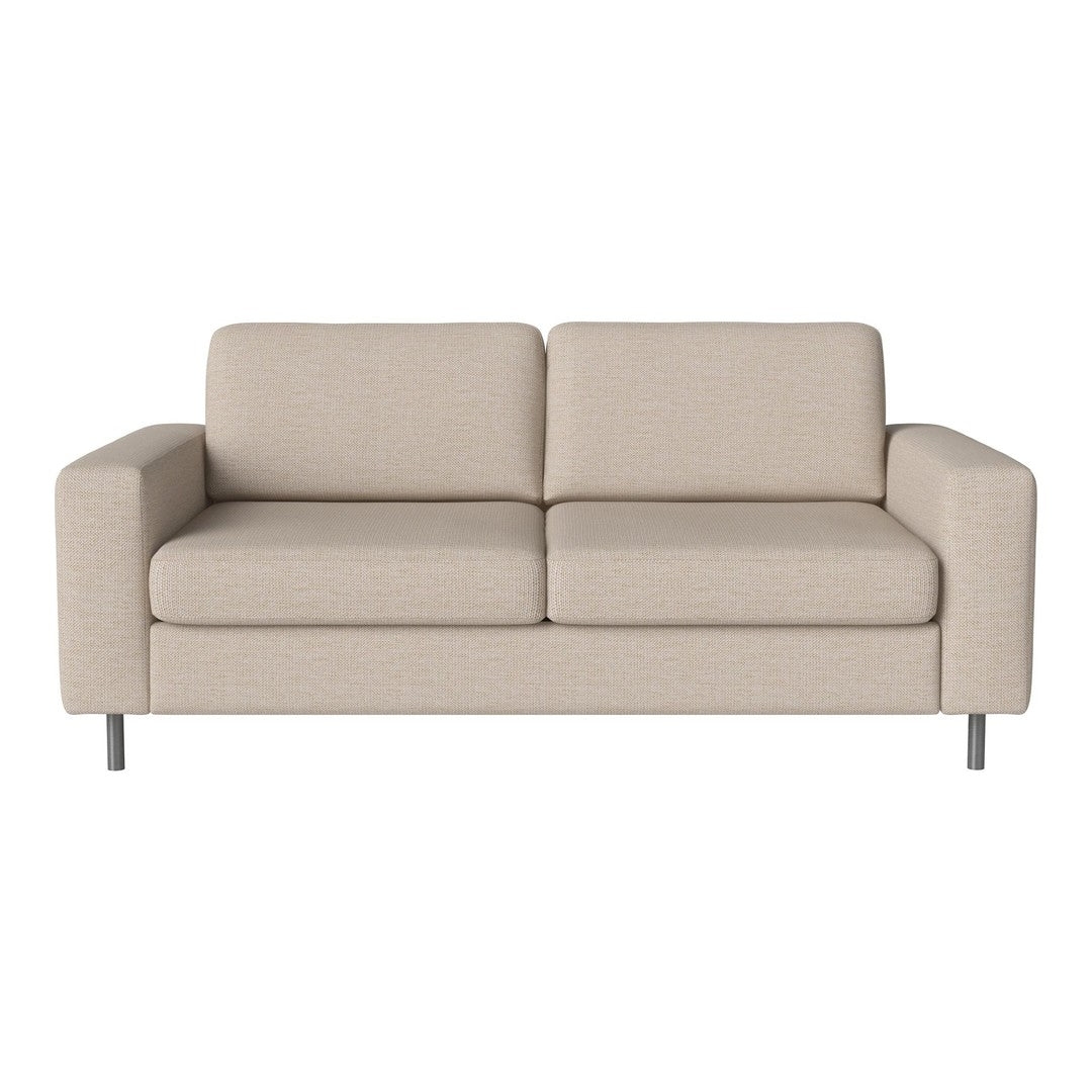 Light beige couch with a smooth texture and simple, modern design. Sleek silver legs complete the clean aesthetic.