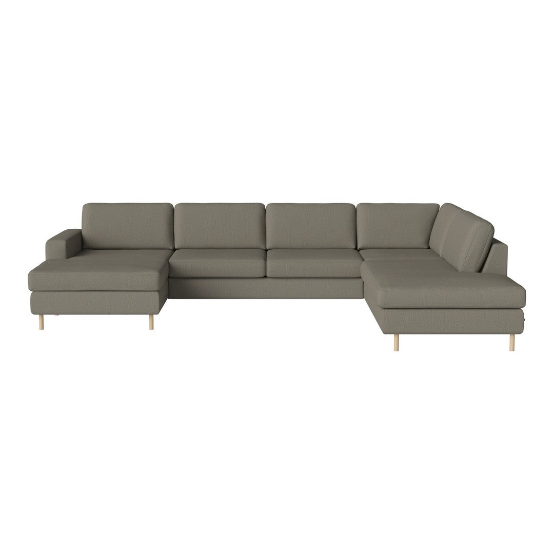 Olive green sectional sofa with a sleek, minimalist design and wooden legs, perfect for modern living spaces.