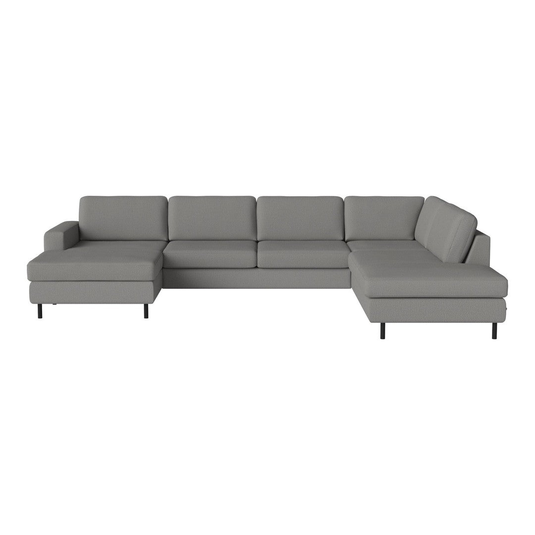 Stylish gray sectional sofa with a modern design, featuring clean lines and a sleek fabric finish.