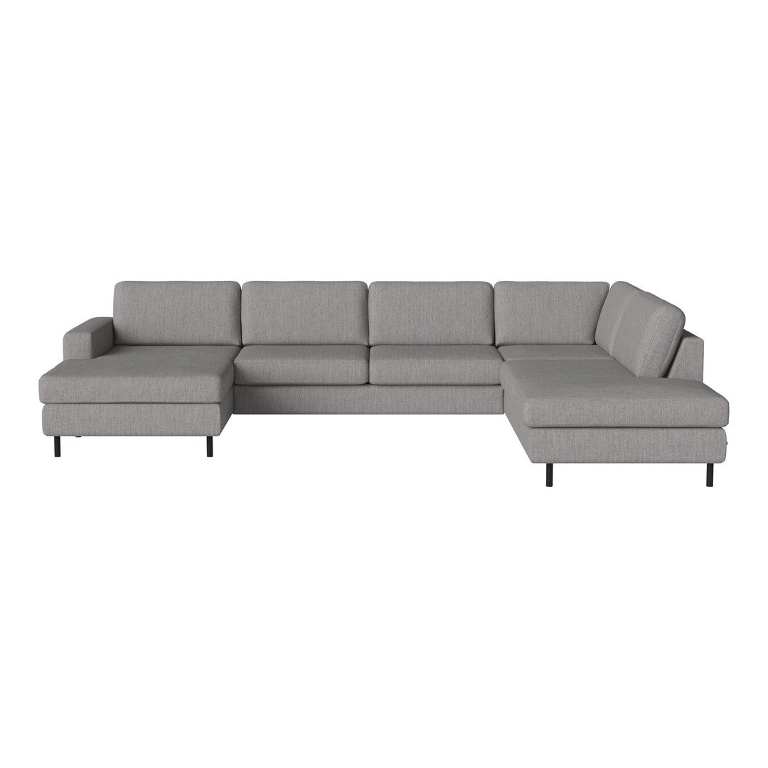 Gray sectional sofa with a modern design and clean lines, featuring a soft fabric texture and minimalist style.
