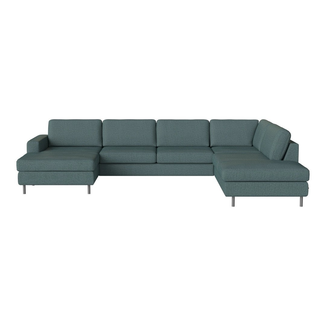 Teal sectional sofa with a modern, minimalist design and clean lines, perfect for contemporary living spaces.