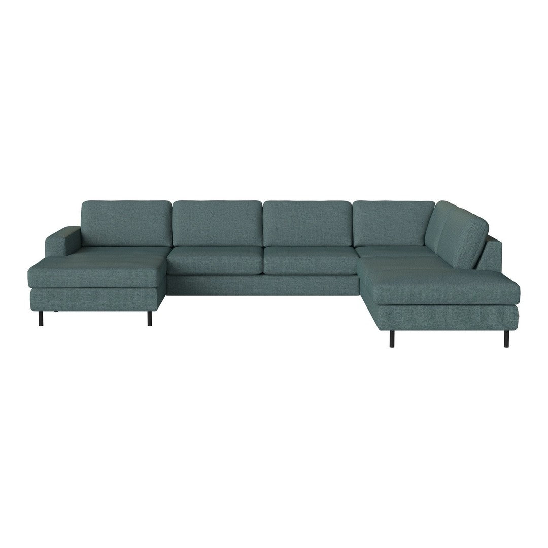 Teal sectional sofa with a modern design, featuring solid, smooth fabric and minimalist black legs. 