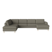 Modern sectional sofa in muted grey fabric with simple, clean lines and light wooden legs.