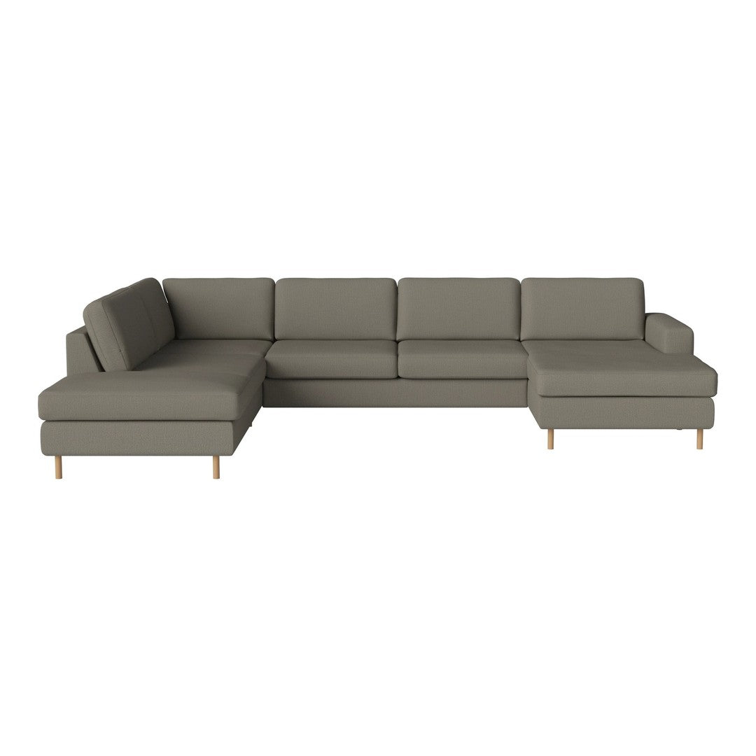 Gray sectional sofa with modern design, featuring clean lines and textured fabric in a neutral tone.