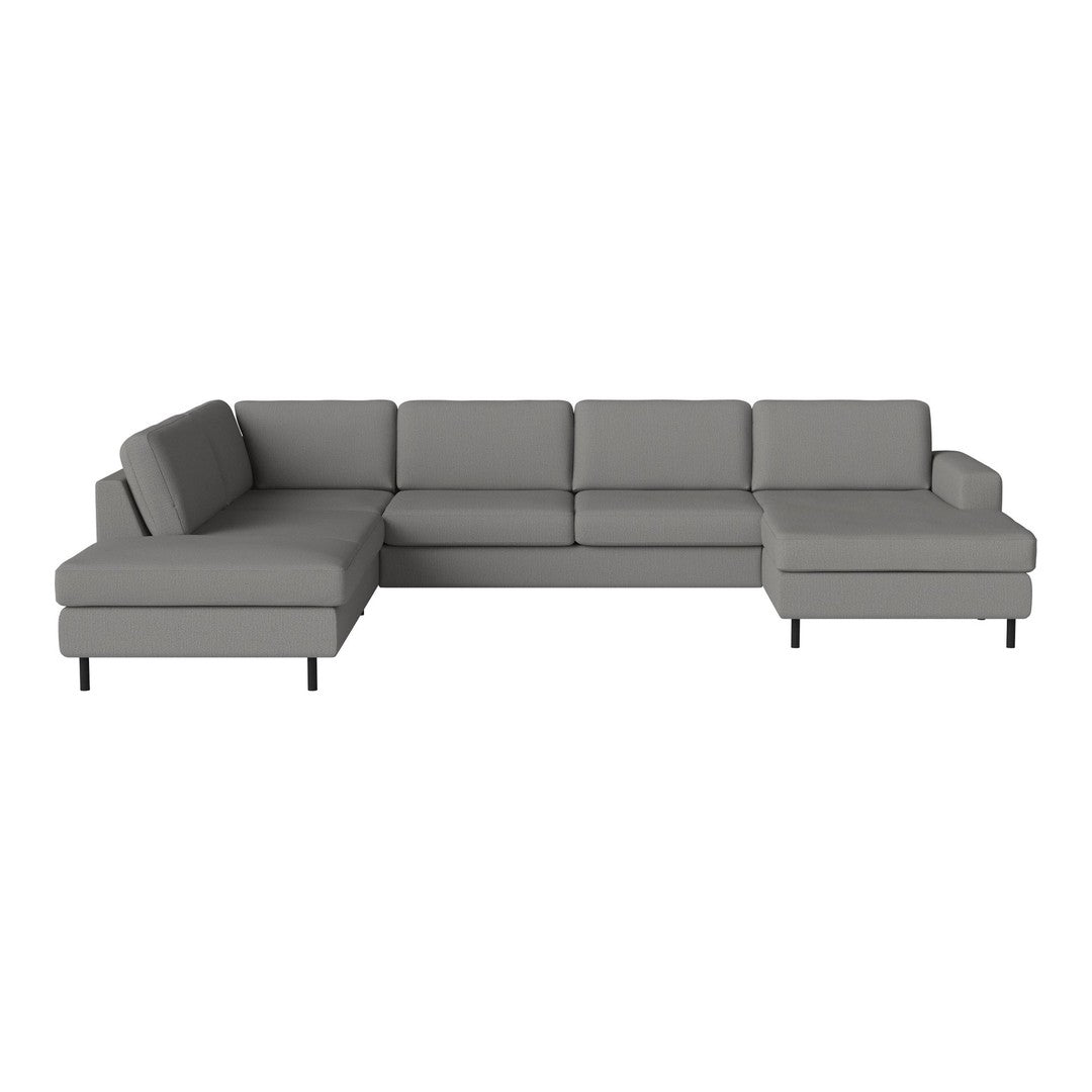 Gray sectional sofa with a contemporary design, featuring sleek lines and minimalistic style.