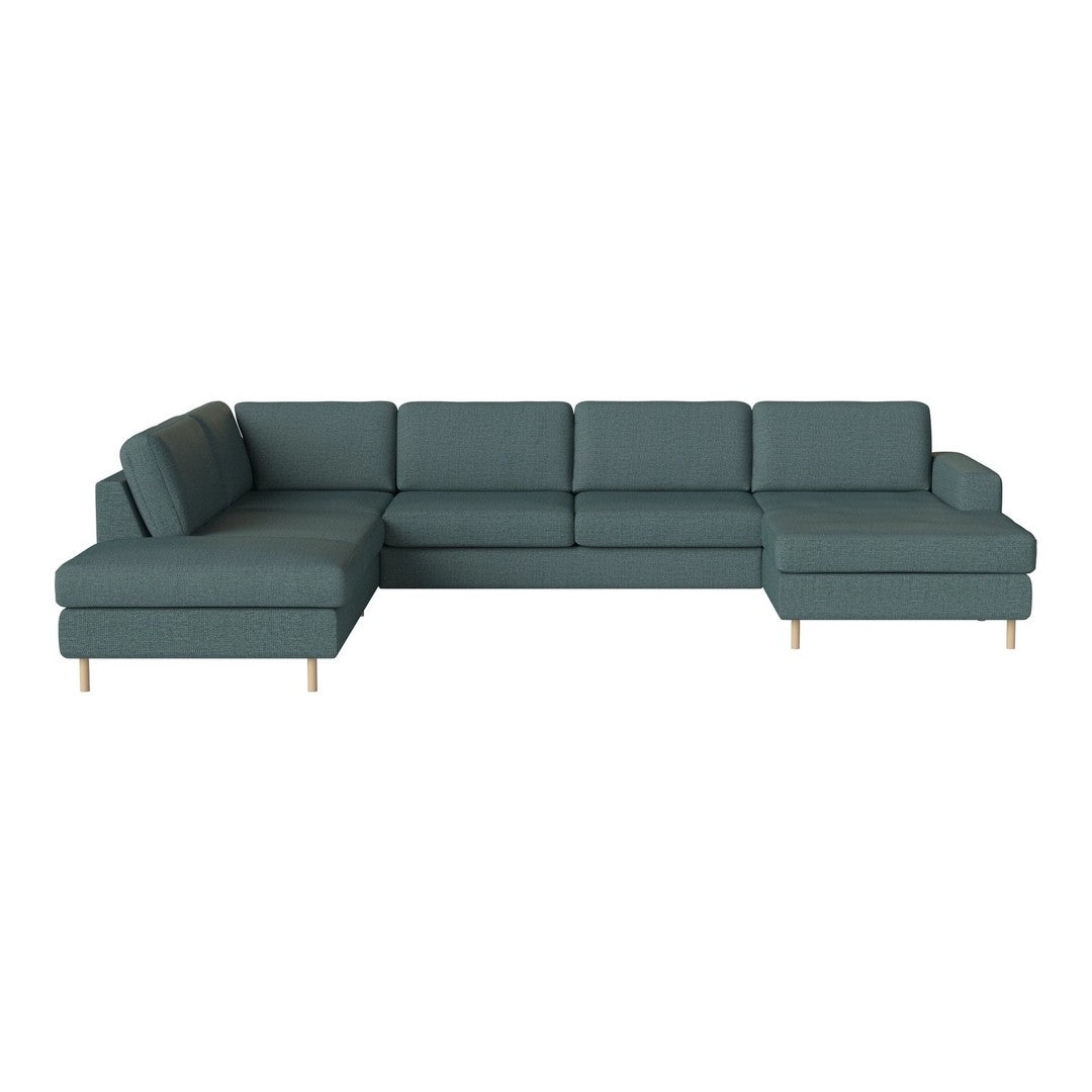 Teal fabric sectional sofa with minimalist lines and wooden legs, perfect for modern living spaces.