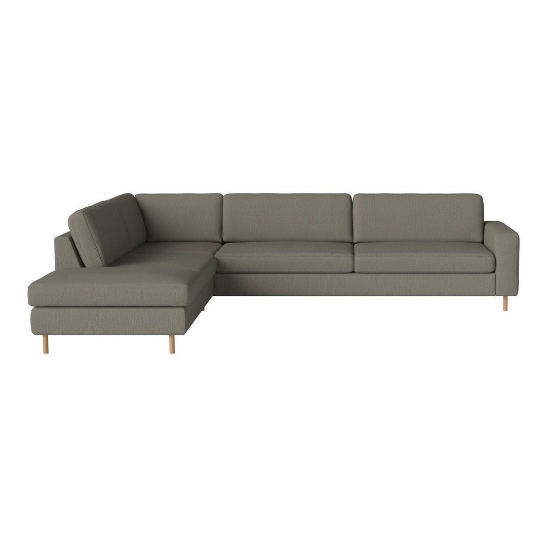 Modern grey sectional sofa with clean lines and a minimalist design, complemented by light wood legs.