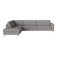 Gray sectional sofa with a minimalist design and wooden legs, featuring a solid color without patterns.