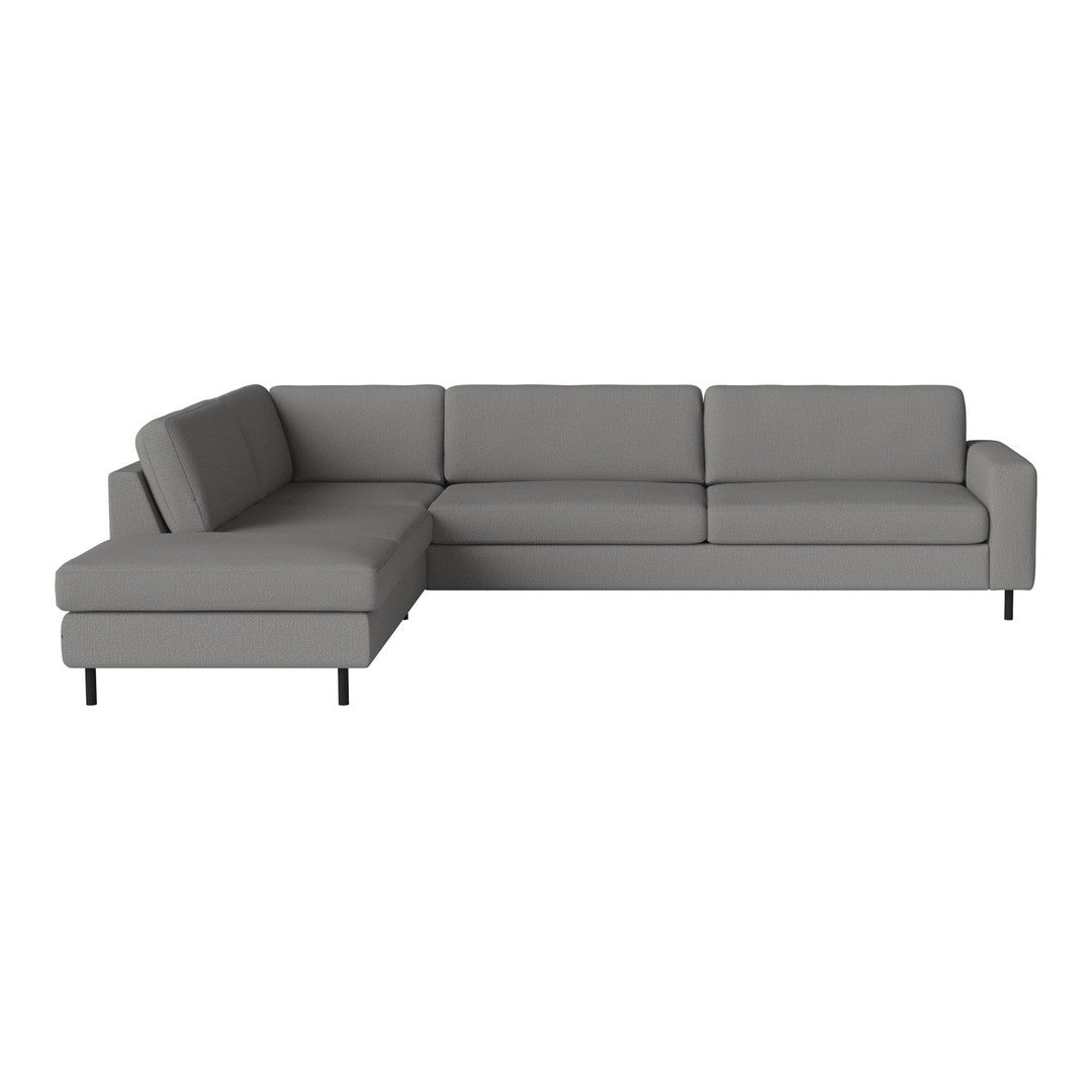 Gray sectional sofa with clean lines and minimalistic design, featuring solid upholstery and sleek black legs.