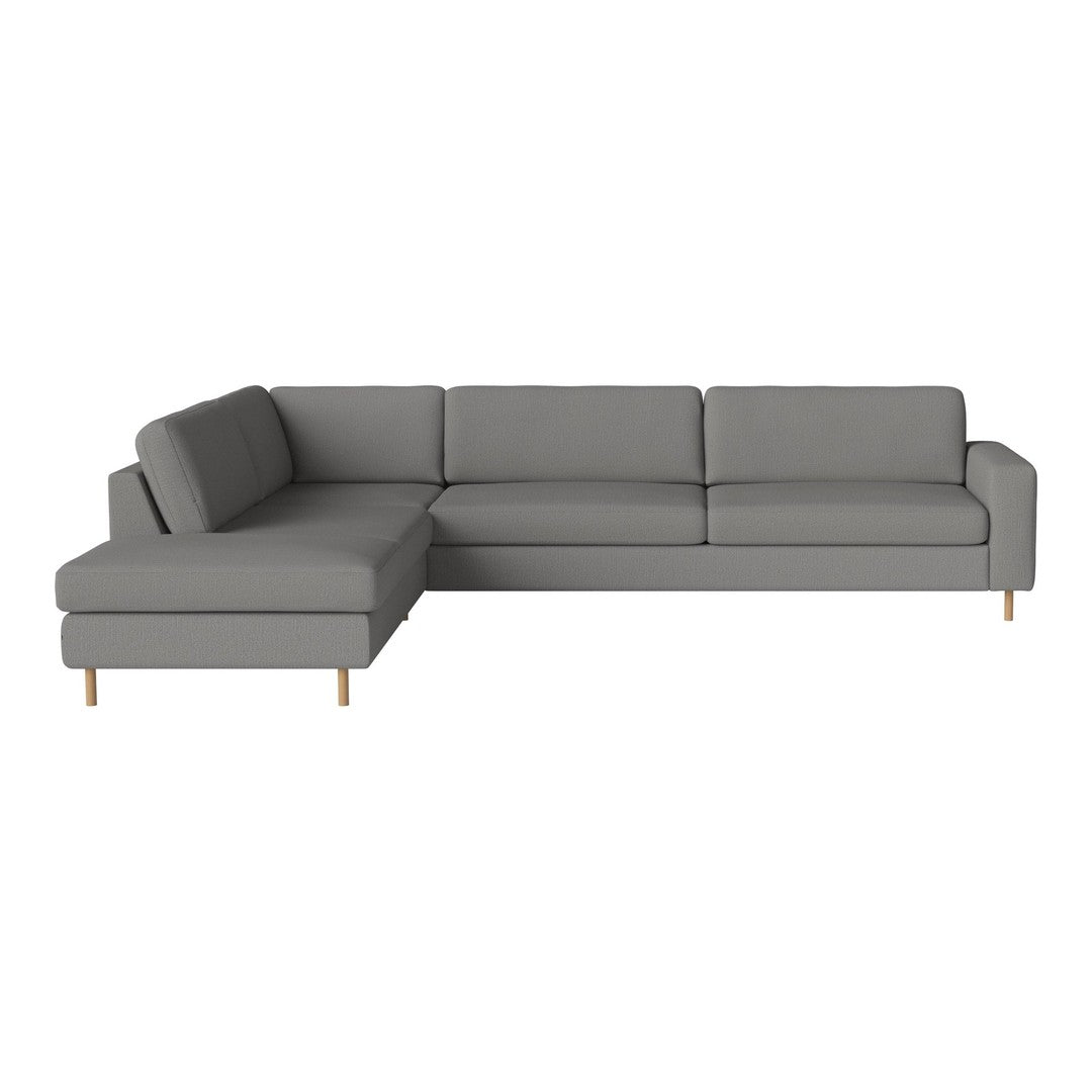 Gray sectional sofa with clean lines and solid color upholstery, featuring natural wood legs. Modern and minimalist design.