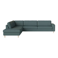Teal sectional sofa with a sleek, minimalistic design and textured fabric, featuring light wooden legs.