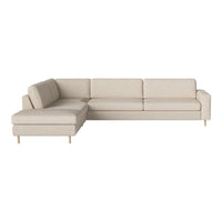 Beige sectional sofa with a minimalist design and soft fabric. Features solid color and clean lines for modern decor.